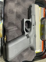 GLOCK G45 TUNGSTEN GRAY AND SILVER - 1 of 4