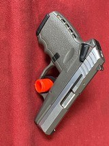SCCY sub compact gray and silver cpx-1 two tone 9MM LUGER (9X19 PARA) - 1 of 3