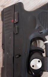 TAURUS PT-740 SLIM .40 CALIBER - 1 of 3