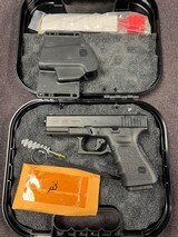 GLOCK 23c .40 S&W - 1 of 3