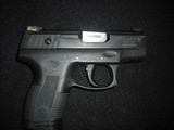TAURUS PT140 PRO MILLENIUM .40 CALIBER - 1 of 3