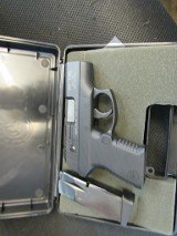 TAURUS PT140 PRO MILLENIUM .40 CALIBER - 1 of 3