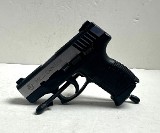 TAURUS PT140 PRO MILLENIUM .40 CALIBER - 1 of 3