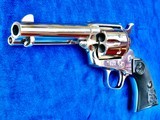 Colt SAA with 4 3/4" Barrel Marked "COLT FRONTIER SIX SHOOTER." 44-40 Cal., Nickel Finish with Black Eagle Grips, New In Box