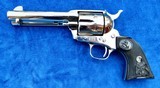 Colt SAA with 4 3/4" Barrel Marked "COLT FRONTIER SIX SHOOTER." 44-40 Cal., Nickel Finish with Black Eagle Grips, New In Box - 2 of 12