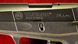 Taurus PT-709, 9mm, Like New with Case - 8 of 13