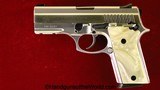 Taurus PT911, 9mm, Stainless with Pearlite Grips - Image 1 of 9
