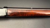 Winchester Model 64 .30 WCF Lever Action Rifle, 24" Barrel, Redfield Adjustable Rear Sight,
(Mfg. 1941)
FINE Condition - 11 of 15