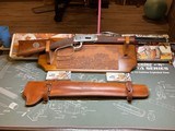 Winchester 94 32-40 John Wayne Commemorative w/ 2 boxes ammo, Display Plaque, Leather Scabbard. - 1 of 13