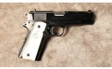 Colt~El Potro~38 super - 1 of 3