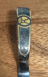 Krieghoff K-80 Fancy Gold Broken Clays Highly Engraved Trigger Guard. - Image 2 of 2