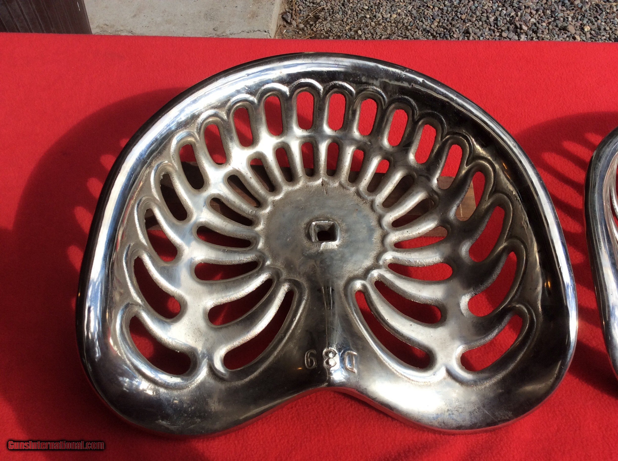 Nickel plated cast iron tractor or implement seats