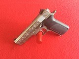 SMITH & WESSON MODEL 1076
10MM
DBL. ACTION AUTO PISTOL,
FULLY ENGRAVED - 2 of 5