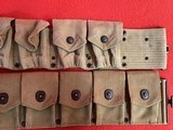 WW 1 AMMUNITION BELTS AND A PAIR OF PUTTEES AND HELMET - 1 of 5