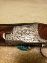 Browning Superposed 12 Gauge O/U, Diana Grade, Vent Rib,
Engraving signed by Mario Bodson, Factory Recoil Pad, Excellent Condition. - 3 of 4