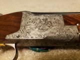Browning Superposed 12 Gauge O/U, Diana Grade, Vent Rib,
Engraving signed by Mario Bodson, Factory Recoil Pad, Excellent Condition. - 2 of 4