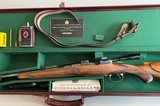 Holland & Holland, Model Deluxe Engraved, Factory Cased 30-06 with Zeiss Scope - 1 of 20
