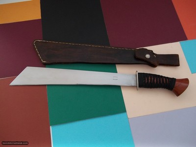 Shiva's Ki one of a
kind machete, cocobolo handle with Japanese raw silk wrap, German silver guard 2004 Production 1 of 3 Ever Produced