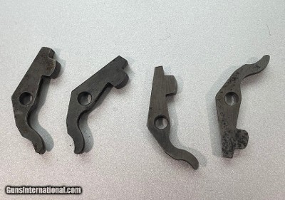 Four (4) Colt Single Action Army NOS bolts...