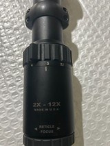 Burris Six X 2X12X40MM, Lighted cross hairs, in Excellent Condition with rings included.  30MM Tube - Image 1 of 6