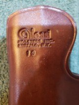 Alessi Hard Shell Talon IWB Holster for Glock 19/23
RH
Brown leather.
Brand new.
1990s Mfg. - 5 of 10