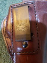 Alessi Hard Shell Talon IWB Holster for Glock 19/23
RH
Brown leather.
Brand new.
1990s Mfg. - 6 of 10
