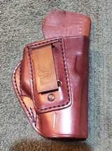 Alessi Hard Shell Talon IWB Holster for Glock 19/23
RH
Brown leather.
Brand new.
1990s Mfg.