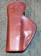 Alessi Hard Shell Talon IWB Holster for Glock 19/23
RH
Brown leather.
Brand new.
1990s Mfg. - 2 of 10