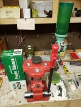 Reloading Package. All American 4 station reloading turret press. RCBS and Pacific Single stage reloading presses. Lyman/Ohaus D-5 Scale. Die Sets.