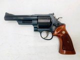 SMITH & WESSON MODEL 25-7 .45 CAL. MODEL OF 1989 .45 COLT W/ UNFLUTED CYLINDER - 1 of 11