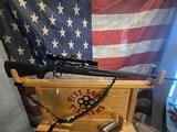 SAVAGE AXIS 223 CALIBER WITH SCOPE AND SLING - 1 of 10