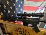 RUGER 204 WITH PSA LOWER A WILSON COMBAT 18 INCH FLUTED BARREL AND RAIL WITH A COLT SCOPE MOUNT and a vortex STRIKE EAGLE SCOPE - 8 of 12