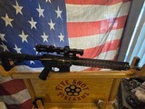 RUGER 204 WITH PSA LOWER A WILSON COMBAT 18 INCH FLUTED BARREL AND RAIL WITH A COLT SCOPE MOUNT and a vortex STRIKE EAGLE SCOPE - 1 of 12