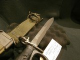 US M7 BAYONET WITH KNUCKLE GUARD AND USM8A1 SCABBARD.
US M7 M-16 KNUCKLE KNIFE.
US M7 BAYONET WITH KNUCKLE GUARD.
US M7 KNUCKLE GUARD BAYONET.
UD - 7 of 12