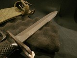US M7 BAYONET WITH KNUCKLE GUARD AND USM8A1 SCABBARD.
US M7 M-16 KNUCKLE KNIFE.
US M7 BAYONET WITH KNUCKLE GUARD.
US M7 KNUCKLE GUARD BAYONET.
UD - 8 of 12
