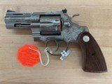 Colt Python
3 inch, new model, SS, Factory Engraved.
New in the box. - 1 of 6