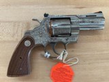 Colt Python
3 inch, new model, SS, Factory Engraved.
New in the box. - 5 of 6