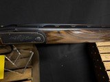 Krieghoff K-20 sporting.
standard engraving with black finish and gold line border,
30 Inch barrel.
like new in the factory case. - 11 of 12