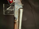 Ithaca 4E, Damascus Barrels,
Completely redone by turnbull.
Mirror bores. - 14 of 15
