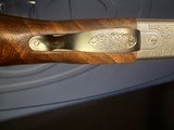Beretta 687 Silver Pigeon iii, Joel Etchen,
TRAP COMBO,
34/32 barrels,
Nice wood, adjustable comb.
Factory Case
LIKE NEW!! - 11 of 11