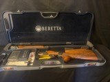 Beretta DT11, 30 inch, over and under with High trap rib.
It looks like new.