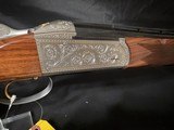 Krieghoff K80, Gold Super Scroll (Silver) 32 inch PARCOUR barrel with thin wall briley c/ts, Excellent Condition.