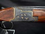 Browning Superposed.1953, 28 inch barrels with Briley thin walls on bottom, IM on top.CUSTOM ENGRAVEDby the late Edward Machu from Texas.