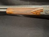Browning Superposed.1953, 28 inch barrels with Briley thin walls on bottom, IM on top.CUSTOM ENGRAVEDby the late Edward Machu from Texas. - 19 of 20
