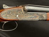 AYA 28 gauge, 26 inch. hand detachable sidelocks like new case color, sharp scroll engraving