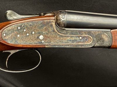 AYA 28 gauge, 26 inch. hand detachable sidelocks like new case color, sharp scroll engraving