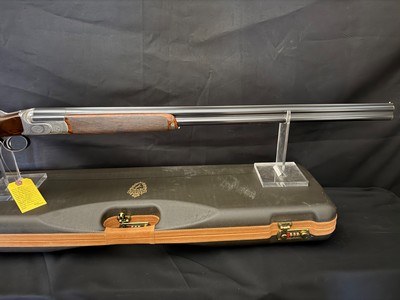 Famars Excaliber Lusso engraning, 20 gauge, 31.5 inch barrel,mod and full.great condition, wood butt plate, factory case