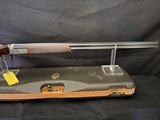 Famars Excaliber Lusso engraning, 20 gauge, 31.5 inch barrel,mod and full.great condition, wood butt plate, factory case