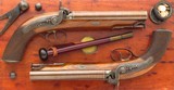 Pair Lang .70 bore percussion howdah pistols, London, cased, circa 1850, consecutive, safeties, engraved, layaway