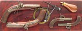 Double set of Lang (London) percussion pistols, two .540 carriage and two .455 turn-barrels, cased with accessories, layaway